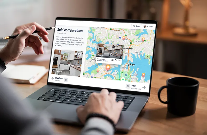 Person analysing sold property comparables and price data on a laptop, with interactive map and listings across Sydney suburbs.