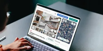 Person browsing property details and satellite view of a home listing on a laptop, showing interior photos and estimated value range.