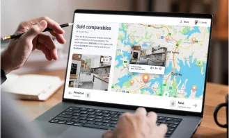 Person analysing sold property comparables and price data on a laptop, with interactive map and listings across Sydney suburbs.